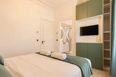 a bedroom with a bed with two towels on it at Luxueuse Villa 7 chambres avec piscine - Cannes in Cannes
