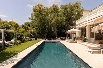 a pool in the backyard of a house at Luxueuse Villa 7 chambres avec piscine - Cannes in Cannes