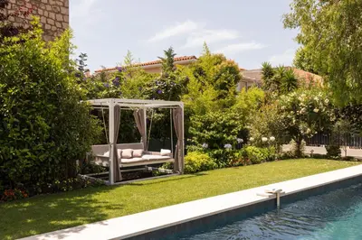 a garden with a gazebo next to a pool at Luxueuse Villa 7 chambres avec piscine - Cannes in Cannes