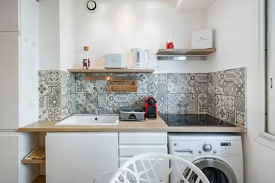 a kitchen with a sink and a washing machine at Centre - 10mn Palais - Plages - Croisette - AT in Cannes