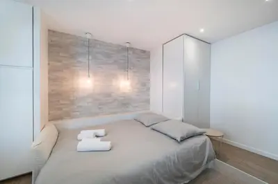 a bedroom with a bed with towels on it at Centre - 10mn Palais - Plages - Croisette - AT in Cannes