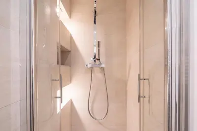 a shower with a shower head in a bathroom at Centre - 10mn Palais - Plages - Croisette - AT in Cannes