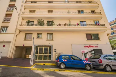 two cars parked in front of a building at Centre - 10mn Palais - Plages - Croisette - AT in Cannes