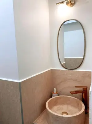 a bathroom with a large tub in front of a mirror at 2 bedroom apartment in Cannes near the beach in Cannes