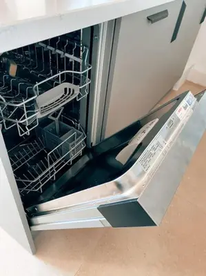 a dishwasher with its door open in a kitchen at 2 bedroom apartment in Cannes near the beach in Cannes