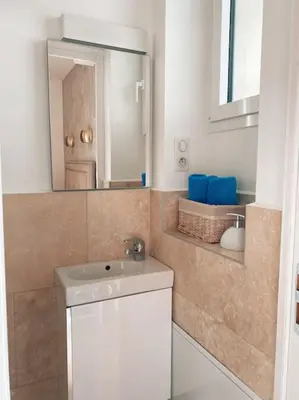 a bathroom with a sink and a mirror at 2 bedroom apartment in Cannes near the beach in Cannes