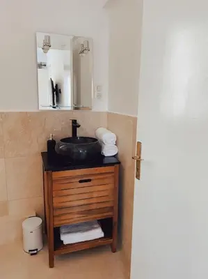 a bathroom with a sink and a mirror at 2 bedroom apartment in Cannes near the beach in Cannes
