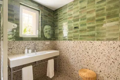 a bathroom with a sink and a window at Modern Luxury Apartment 6 pax in Cannes