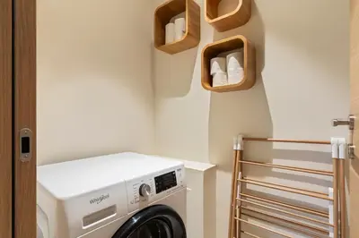 a laundry room with a washer and dryer at Modern Luxury Apartment 6 pax in Cannes