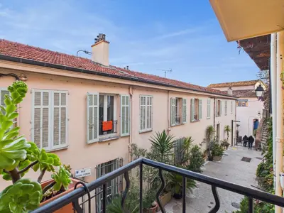 a view of a building from a balcony at LE CHARMANT sublime Maison de Ville dans le Suquet au calme in Cannes