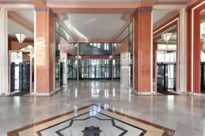 an empty lobby of a building with a large floor at Appartement Miramar Cannes Croisette in Cannes