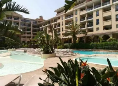 a large apartment building with a large swimming pool at Appartement 172 in Cannes