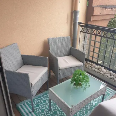 two chairs and a table on a balcony at Appartement 172 in Cannes