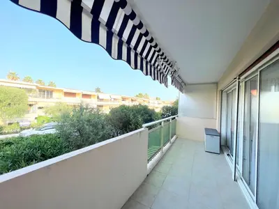 an empty balcony with a view of a building at Copacabana beach, by Welcome to Cannes in Cannes