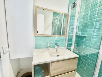 a bathroom with a sink and a mirror at Copacabana beach, by Welcome to Cannes in Cannes