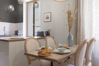 a table with chairs and a table with food on it at 