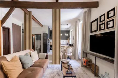 a living room with a couch and a flat screen tv at 