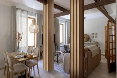 a living room with a table and a dining room at 