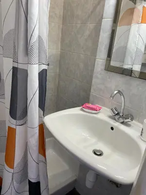 a bathroom with a sink and a shower curtain at Studio in Cannes