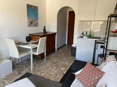 a small kitchen with a table and a kitchen gmaxwell gmaxwell gmaxwell gmaxwell gmaxwell at Studio in Cannes