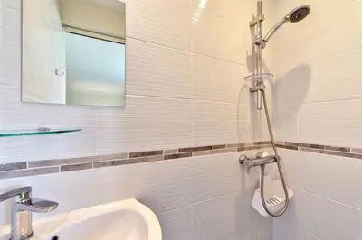 a bathroom with a sink and a shower at Appartement le San Francisco bright and calm 3 bedroom flat in Cannes