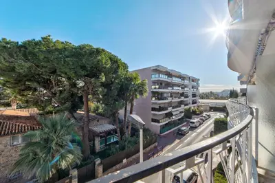 a balcony with a view of a street and a building at Appartement le San Francisco bright and calm 3 bedroom flat in Cannes