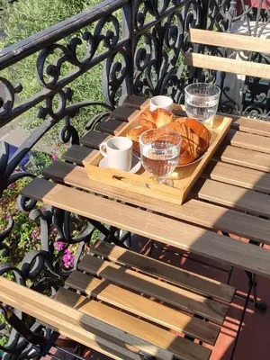 a wooden table with a tray of pastries on it at Le QG - CANNES - Palais du Festival in Cannes
