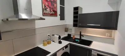 a kitchen with a sink and a microwave at Le QG - CANNES - Palais du Festival in Cannes