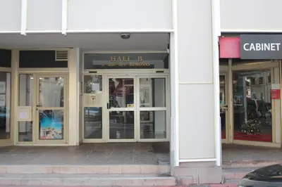 a store front of a building with glass doors at Heart of Cannes contemporary 2BR garden view Palais & Croisette 5 mn by Olam Properties in Cannes