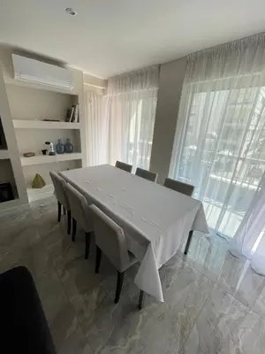 a dining room with a white table and chairs at Cannes Centre ville in Cannes