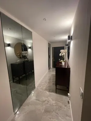 a hallway with a mirror and a vanity and a room at Cannes Centre ville in Cannes