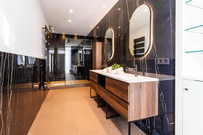 a bathroom with a sink and a mirror at croisette appartement 3 chambres The Six in Cannes