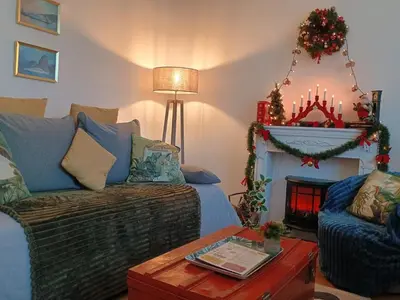 a living room with a couch and a fire place at Cannes Holidays - Charmant, authentique, 3 Chambres, calme, Palais & Plage in Cannes