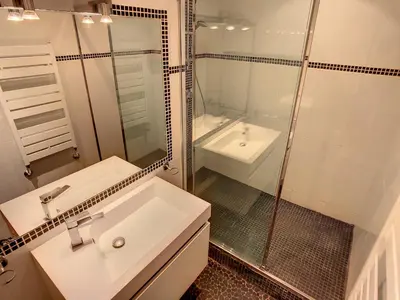 a white bathroom with a sink and a shower at Quality 1 bedroom rue du Canada 5 mins Croisette 208 in Cannes