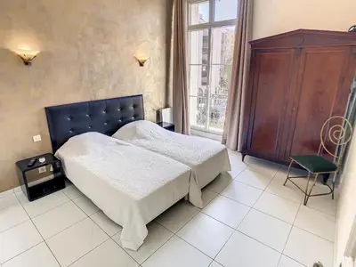 a bedroom with a bed and a window and a chair at Quality 1 bedroom rue du Canada 5 mins Croisette 208 in Cannes