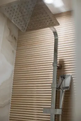 a light on the wall of a building at Jungle Room Jacuzzi Privé Évasion en amoureux in Cannes