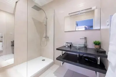 a bathroom with a sink and a shower at Nice 2 Rooms in the heart of Cannes in Cannes