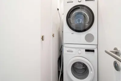 a washing machine and a washer and dryer in a room at Superb 55m2 apartment - Heart of Cannes - 2BR4p in Cannes