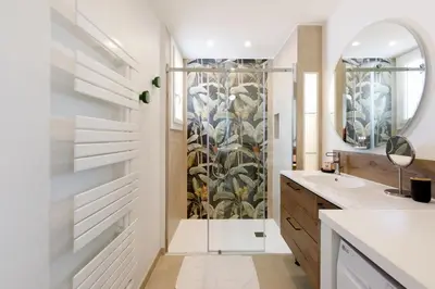 a bathroom with a shower and a sink at Wam YourHostHelper in Cannes