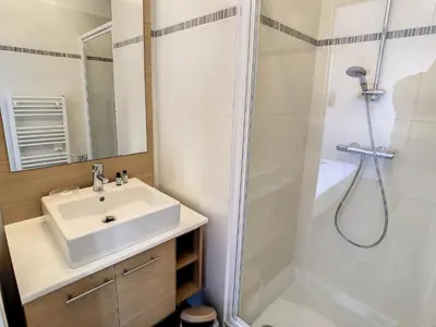 a bathroom with a sink and a shower at 3 Bedrooms, 3 bathrooms central Cannes Lecerf 411 in Cannes