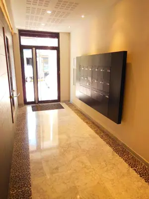 a hallway with a large television on the wall at 3 Bedrooms, 3 bathrooms central Cannes Lecerf 411 in Cannes
