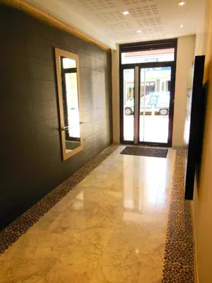 a hallway of a building with a door and a mirror at 3 Bedrooms, 3 bathrooms central Cannes Lecerf 411 in Cannes