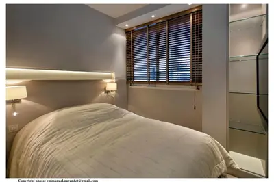 a bedroom with a white bed and a window at REF 761 - Cannes Croisette - Sea view apartment for rent in Cannes
