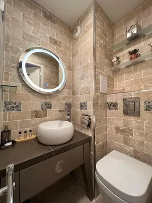 a bathroom with a sink and a toilet and a mirror at Cannes Villa Francia in Cannes