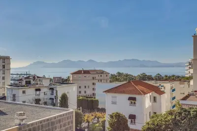 a view of a city from the roof of a building at Appartement Alexandre lumineux avec superbe vue mer in Cannes