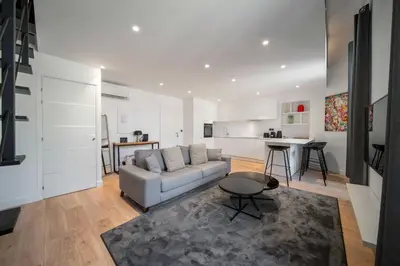 a living room with a couch and a table at Charming apartment for 4 people - Forville Market in Cannes