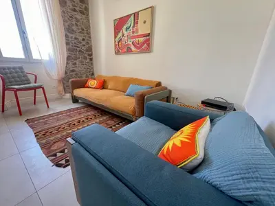a living room with a couch and a chair at Sunset by Connexion in Cannes