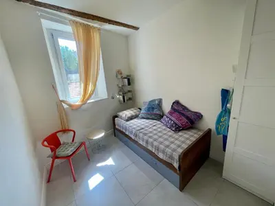 a small room with a couch and a window at Sunset by Connexion in Cannes