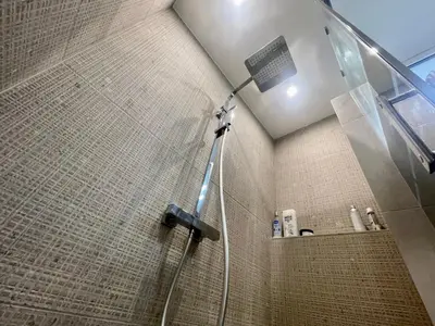 a shower with a shower head in a bathroom at Sunset by Connexion in Cannes