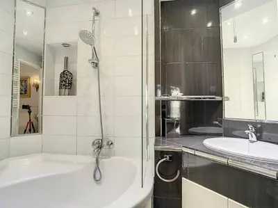 a bathroom with a bath tub and a sink at Apartment Center of Cannes, Croisette in Cannes